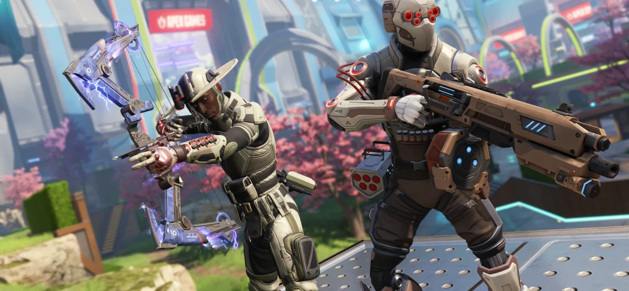 Dois personagens de Apex Legends equipados com trajes táticos e armas tecnológicas em um cenário futurista com cerejeiras ao fundo. Um personagem à esquerda empunha um arco eletrificado e o à direita segura um rifle de assalto pesado