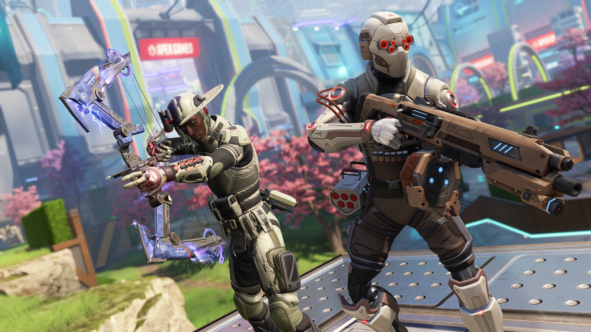Dois personagens de Apex Legends equipados com trajes táticos e armas tecnológicas em um cenário futurista com cerejeiras ao fundo. Um personagem à esquerda empunha um arco eletrificado e o à direita segura um rifle de assalto pesado